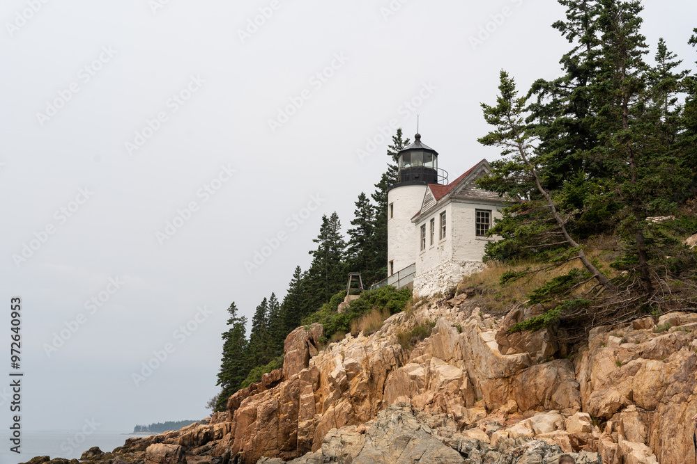 A view of Bass Harbor Head Light Station up on the cliffs of coastal Maine. A view of Bass Harbor Head Light Station up on the cliffs of coastal Maine.