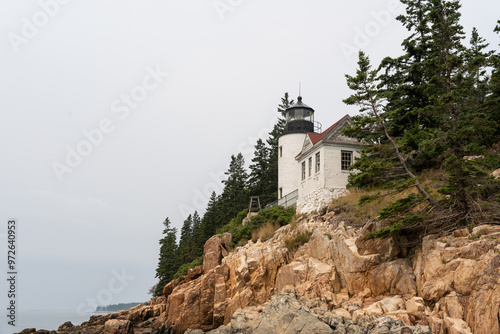 A view of Bass Harbor Head Light Station up on the cliffs of coastal Maine. photo
