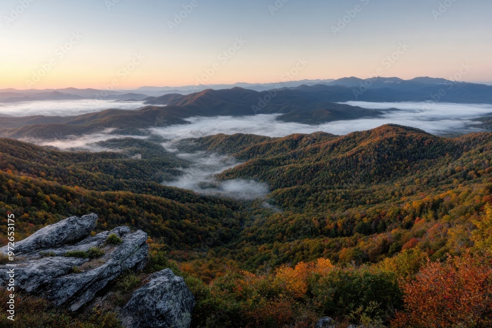 A mesmerizing capture of layered mountain ranges with morning mist and vibrant autumn foliage, offering a serene and picturesque representation of nature's splendor. A mesmerizing capture of layered mountain ranges with morning mist and vibrant autumn foliage, offering a serene and picturesque representation of nature's splendor.