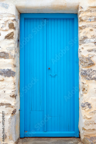 Blue door of a traditional Greek house in Tholaria on Amorgos island. Cyclades, Greece