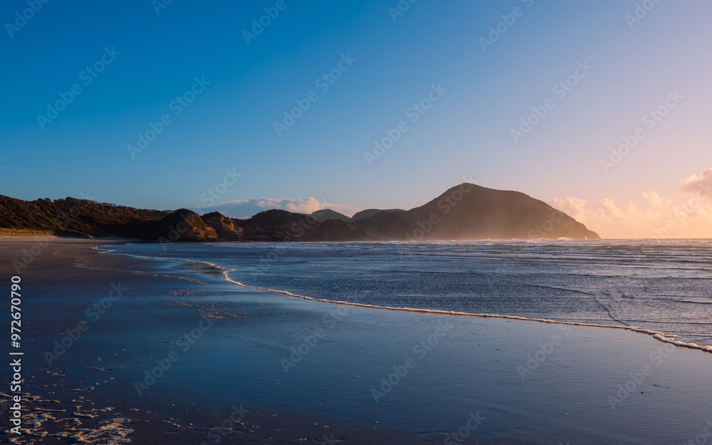 Beautiful sunset view at Wharariki Beach. Beautiful sunset view at Wharariki Beach.