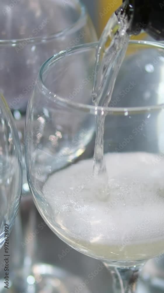 pour champagne into a glass goblet pour champagne into a glass goblet