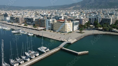 Aerial shot 4k of harbor and university of Volos, Greece 
