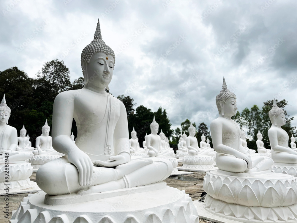 White Buddha Stone statue of a Buddha, Ubon Ratchathani Thailand, Buddha statue is immersed in meditation, Lord Buddha sculpture White Buddha Stone statue of a Buddha, Ubon Ratchathani Thailand, Buddha statue is immersed in meditation, Lord Buddha sculpture