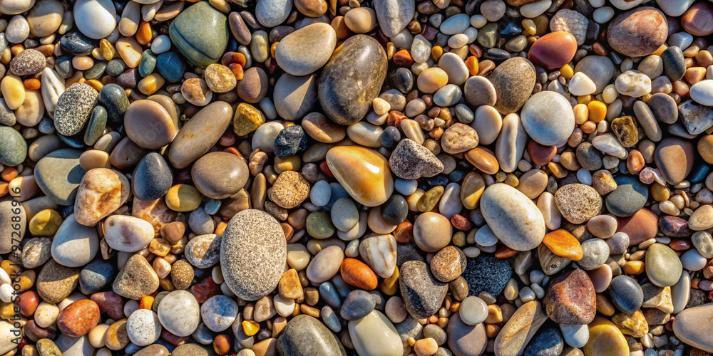 Naklejka premium Smooth Pebbles on the Shore with Calm Waves and Natural Beauty