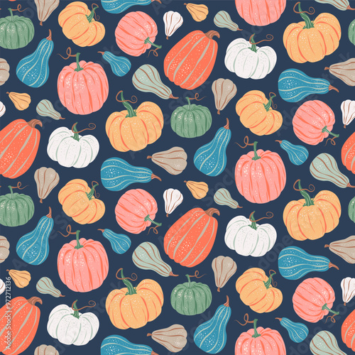 Seamless pattern of colorful pumpkins on dark blue background.. Vector illustration in a flat style. Halloween, Thanksgiving, harvest, autumn season fabric, packaging, wrapping paper, wallpaper design