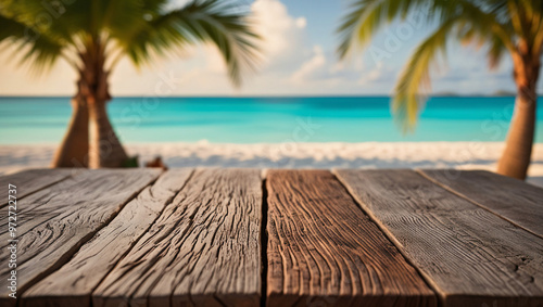 Wooden table top with the blurred tropical beach landscape for display or montage your products.