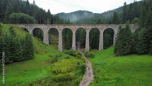 A stunning drone video of Chmarošský Viaduct in Slovakia showcases its impressive stone arches, nestled in lush forests and scenic mountain landscapes
