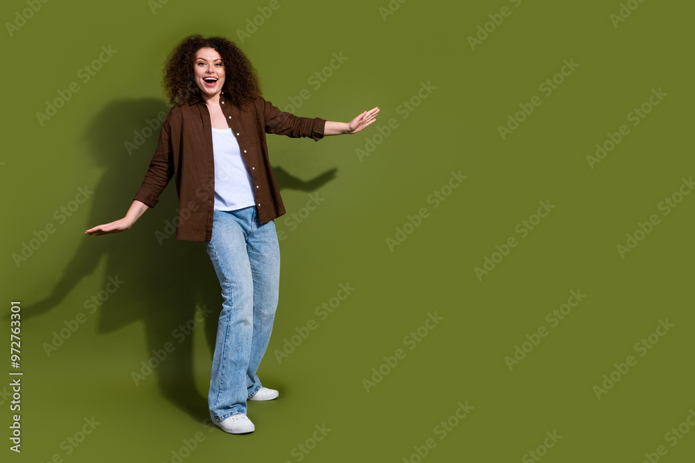 Full body portrait of nice young girl dance empty space isolated on khaki color background Full body portrait of nice young girl dance empty space isolated on khaki color background