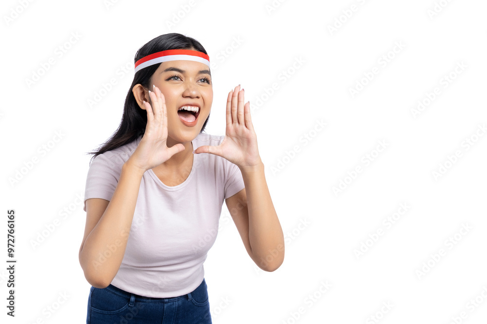 Cheerful young Asian woman shouting with hands near mouth isolated on white background. Indonesian Independence Day Celebration Concept Cheerful young Asian woman shouting with hands near mouth isolated on white background. Indonesian Independence Day Celebration Concept