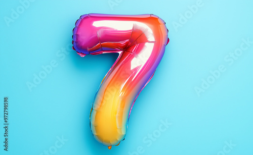 Colorful Number 7 Balloon on a Bright Blue Background photo