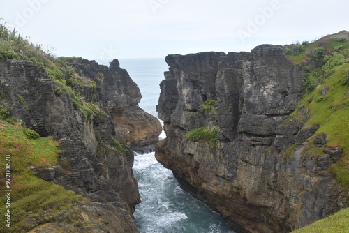 Hiking along the Punakaiki River Track and coastline in the Paparoa National Park, New Zealand