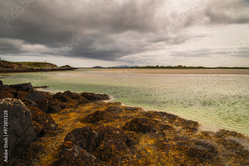 An overcast, summer, HDR image of the Claddach Baleshare coastline at low tide on North Uist, Outer Hebrides, Scotland photo