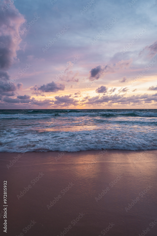 pink and orange sunset with clouds at karong beach in phuket pink and orange sunset with clouds at karong beach in phuket
