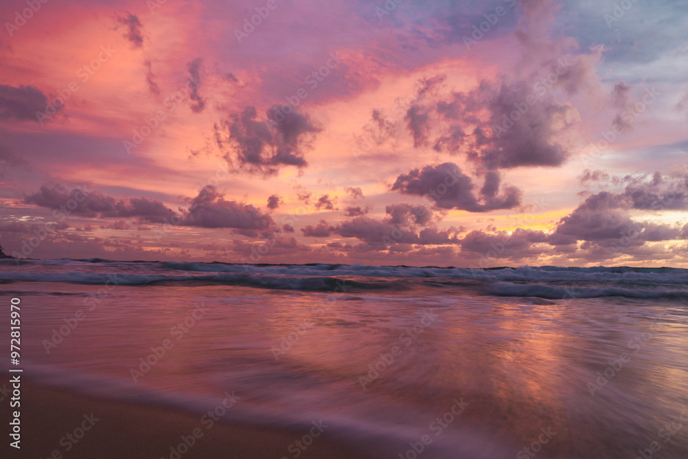 pink and orange sunset with clouds at karong beach in phuket pink and orange sunset with clouds at karong beach in phuket