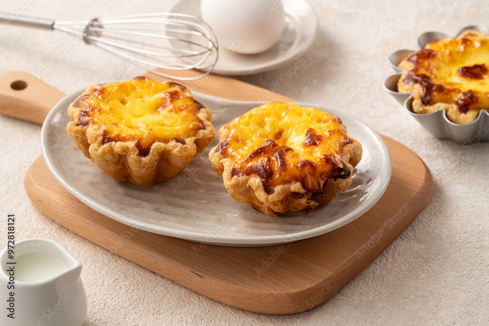Delicious puff pastry Portuguese egg tart Pastel de nata in flower shape. Delicious puff pastry Portuguese egg tart Pastel de nata in flower shape.