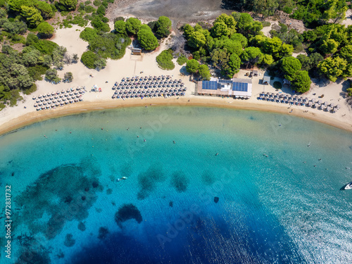 Aerial top view of the pristine beach and turquoise sea at Tsougrias island, Skiathos, Sporades, Greece