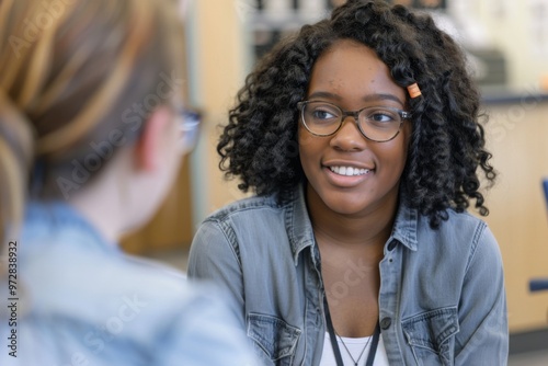 A student is talking with a school counselor about college plans and future aspirations