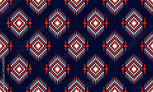 a detailed pattern composed of pixel designs with orange and white square on dark blue background , design for fabric or various pattern printing works.