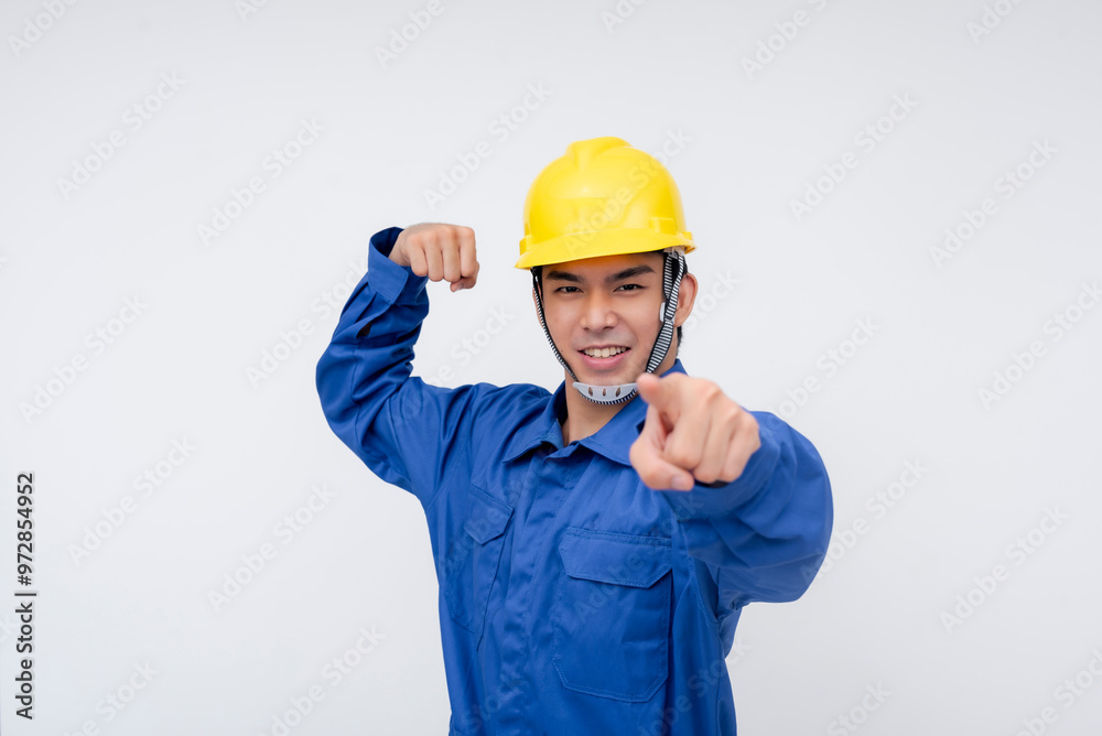 A smiling asian worker flexes his arm and points forward, confidently displaying strength and readiness. Great for promoting hard work, leadership, and confidence in the workplace A smiling asian worker flexes his arm and points forward, confidently displaying strength and readiness. Great for promoting hard work, leadership, and confidence in the workplace