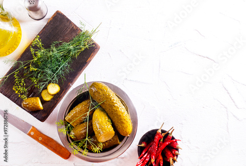 picled cucumber in bowl, cucumber with dill photo