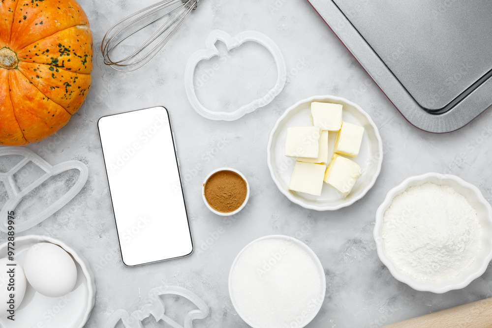 Ingredients for baking cookies for Halloween, smartphone mock-up. Seasonal autumn baking Ingredients for baking cookies for Halloween, smartphone mock-up. Seasonal autumn baking
