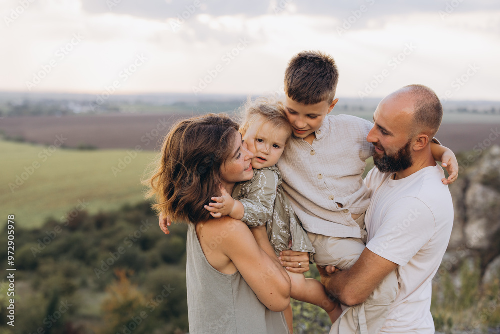 Happy Family Enjoying Outdoor Quality Time Together in Scenic Nature Setting Happy Family Enjoying Outdoor Quality Time Together in Scenic Nature Setting