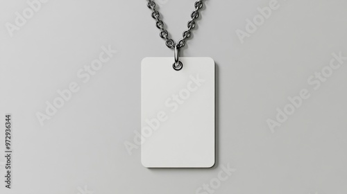 A realistic vector mockup of a blank white square clothing label attached to a metal ball chain, serving as an empty price tag template for design purposes.