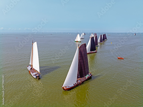 Aerial from competition skutsjesilen near Hindeloopen on the IJsselmeer in the Netherlands photo