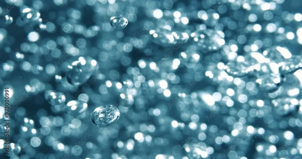 Many water bubbles in blue water close up, abstract water wave with bubbles in slow motion. Many water bubbles in blue water close up, abstract water wave with bubbles in slow motion.