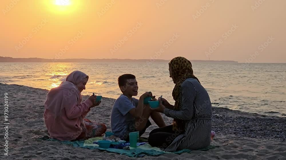 Muslims on the beach, mother with daughter, hijab, girls in hijab, Muslims relaxing at sea, travel, Muslims having fun on the beach, dinner after sunset, faith, Ramadan, Eid al-Fitr, Bayram, sunset Muslims on the beach, mother with daughter, hijab, girls in hijab, Muslims relaxing at sea, travel, Muslims having fun on the beach, dinner after sunset, faith, Ramadan, Eid al-Fitr, Bayram, sunset