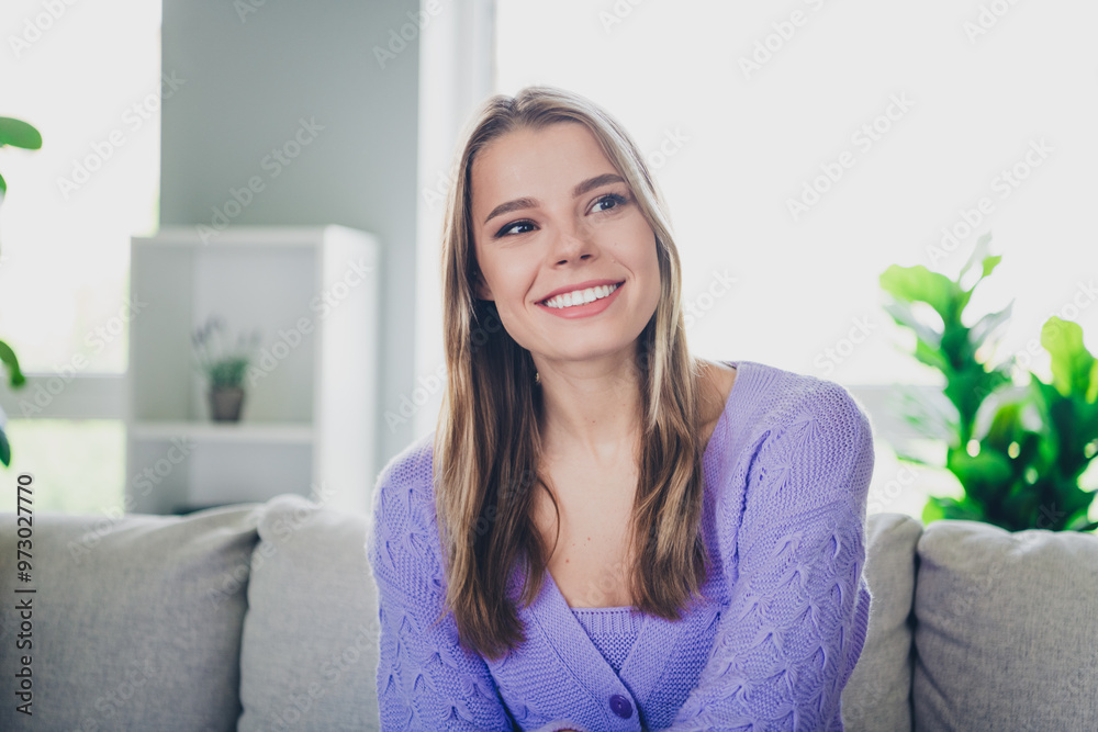 Photo of lovely cheerful girl sit couch charming look empty space dressed violet garment spend pastime spacious house indoors room Photo of lovely cheerful girl sit couch charming look empty space dressed violet garment spend pastime spacious house indoors room