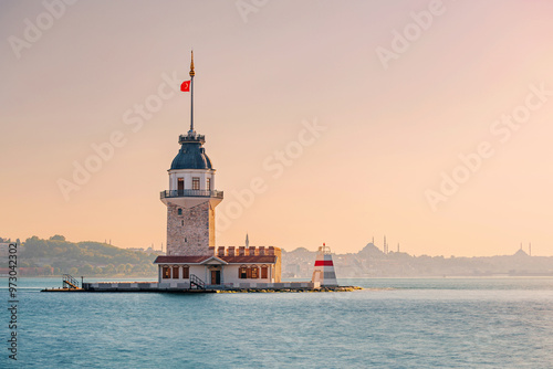 A beautiful evening view of Kiz Kulesi, with the ancient lighthouse reflecting golden hues against the Marmara Sea in Istanbul