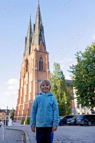 Family with children and pet dog, visiting nortern cities in Sweden, Uppsala #973057113