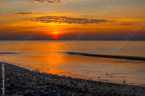 Obraz na płótnie Sandy beach with pebbles of Baltic Sea on Curonian Spit at sunset. Kaliningrad region. Russia w salonie