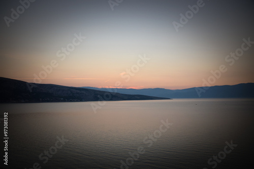 sunrise over the sea, clear sky without clouds. golden hour.	
