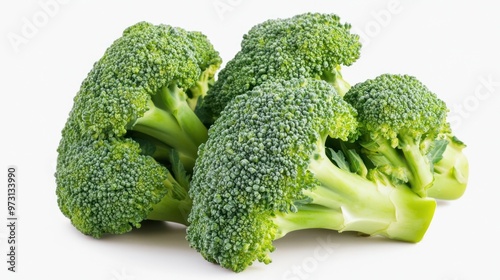 Fresh broccoli heads arranged on a white background, showcasing their vibrant green color.