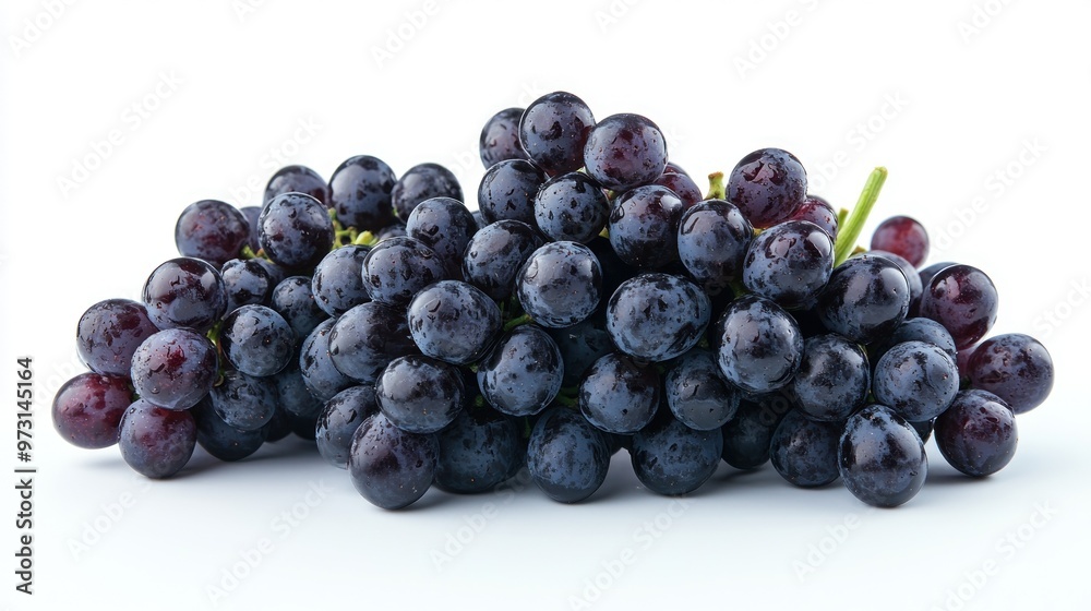 A cluster of fresh, dark purple grapes with a shiny appearance on a white background. A cluster of fresh, dark purple grapes with a shiny appearance on a white background.