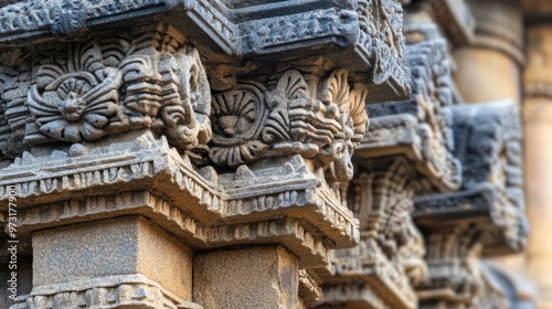 Intricate stone carvings on temple columns showcasing detailed artistry and craftsmanship in an ancient structure during daylight