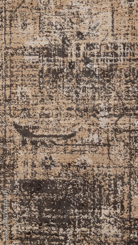 Texture of a worn brown carpet