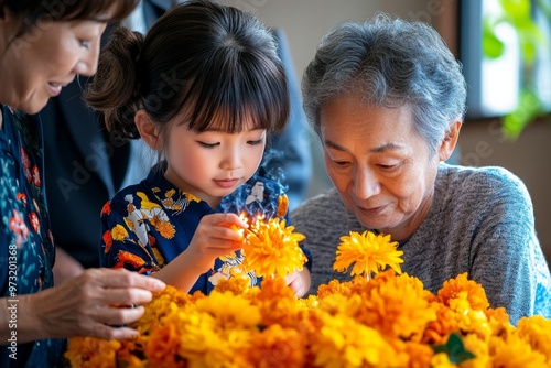 A young child learning to light incense, with their grandparents explaining the significance of the ritual during Obon photo