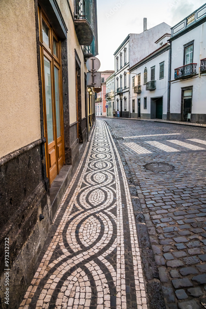 Obraz premium A view of a decorative pavement in Ponta Delgada on the island of San Miguel in the Azores in summertime