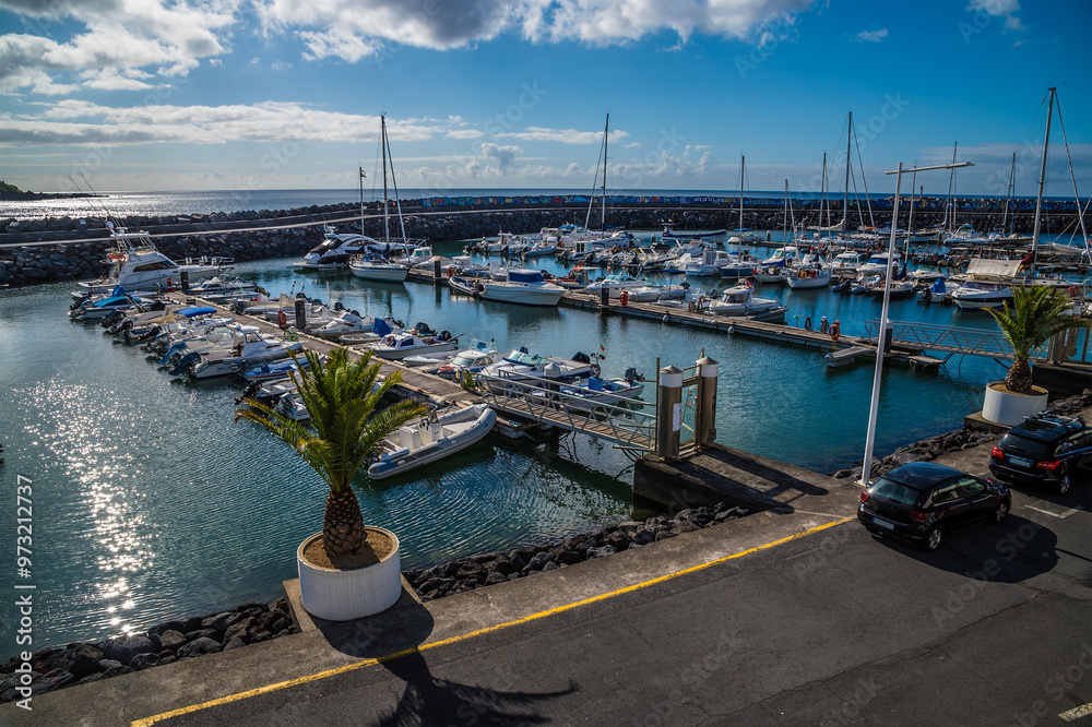 Fototapeta premium A view across the marina in San Roque on the island of San Miguel in the Azores in summertime
