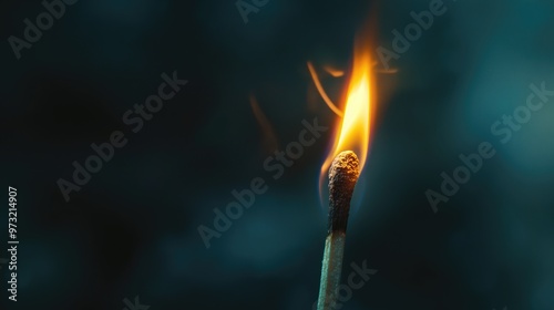 One match burns on a dark background, close-up.