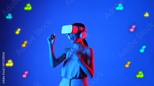 Enjoyment woman singing song wearing VR headset with graphic neon note melody musical modern design at studio dynamic lighting floating in music and technology concept blue background. Hallucination.