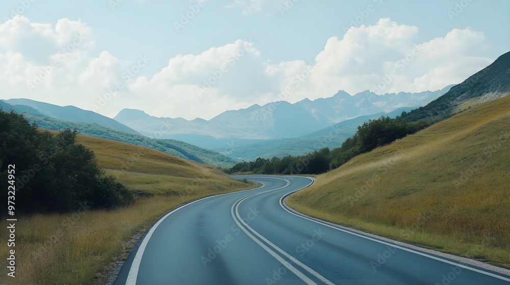 Fototapeta premium Long winding road vanishing into distant scenery image