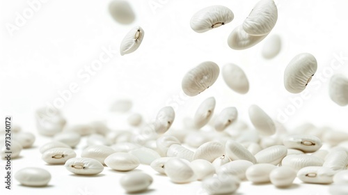 A pile of white beans on a white surface