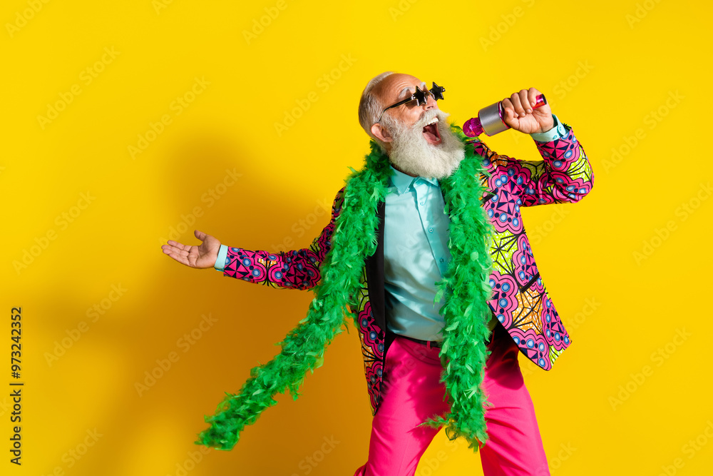 Photo of eccentric elderly singer star shape sunglass sing wear vibrant outfit isolated on yellow color background