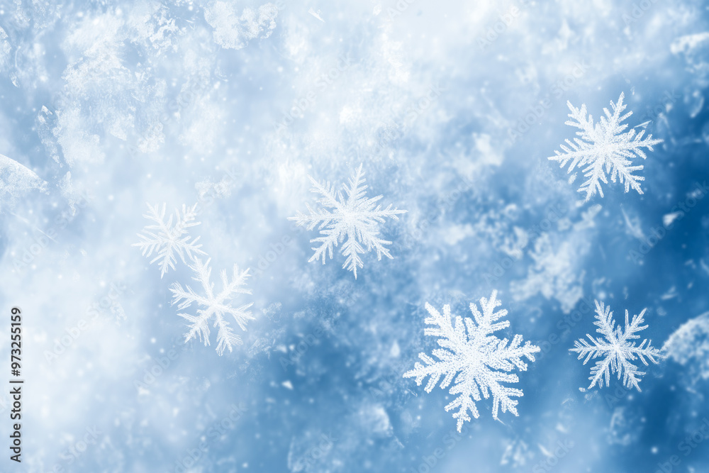 Icy blue snowflakes floating on a frosty winter background Icy blue snowflakes floating on a frosty winter background