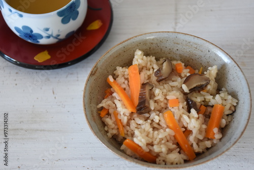 Takikomi Gohan is a Japanese rice dish with short-grain rice with vegetables, mushrooms, seafood, or meat. Often served with pickels and miso soup. photo